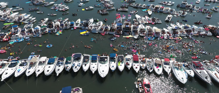 Lines of boats tied off together during Raft Off or Jobbie Nooner